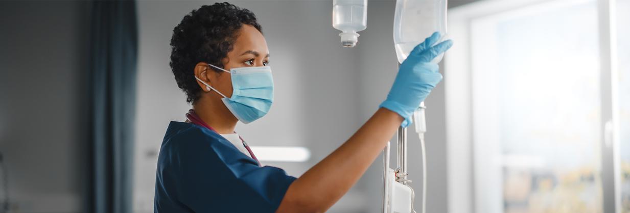 Registered Nurse checking IV bag