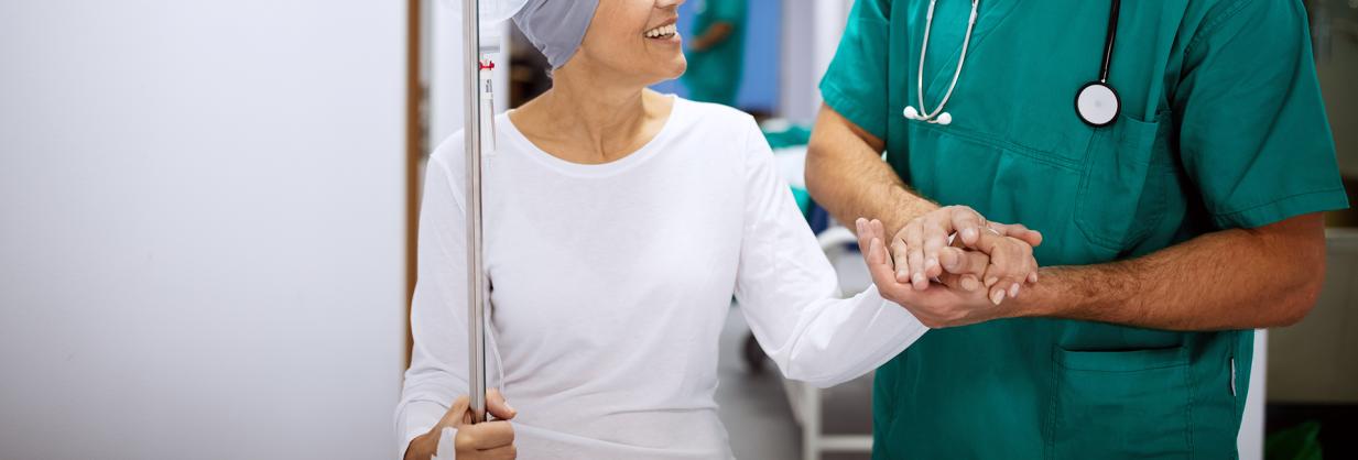 Physician holding a woman's hand