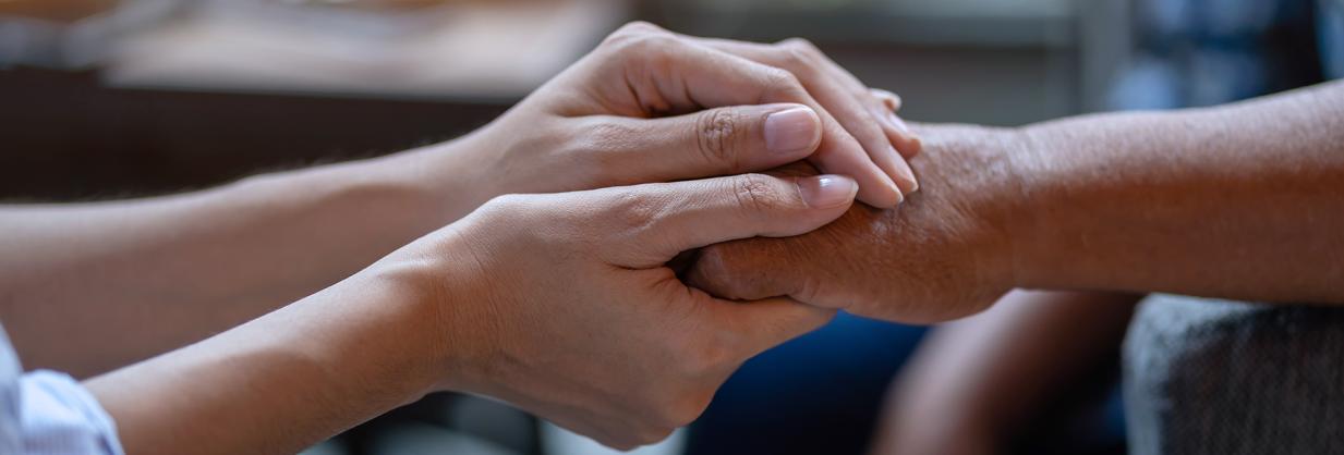 Two people holding hands