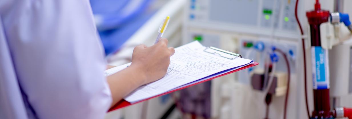 Healthcare worker completing a form