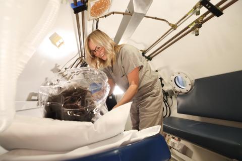 a woman in a respiratory machine with a patient