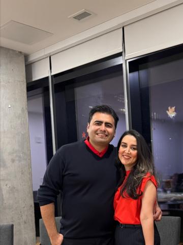 a man and woman in red and black 